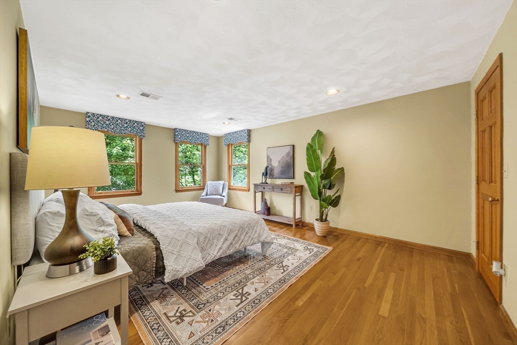 83 Jefferson Road Franklin, MA 02038 - Photo 14 of 34 a bedroom with a bed and wooden floor