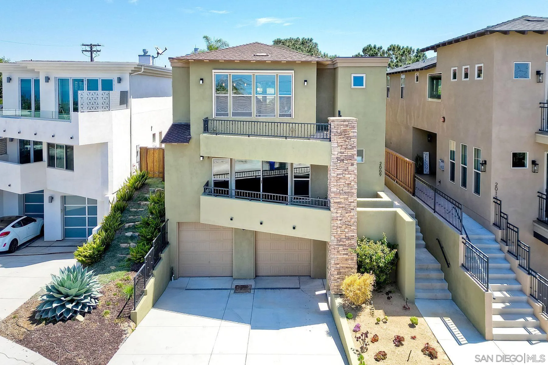 2009 MacKinnon Avenue Encinitas, CA 92007 - Photo 1 of 46 a front view of a house with a yard