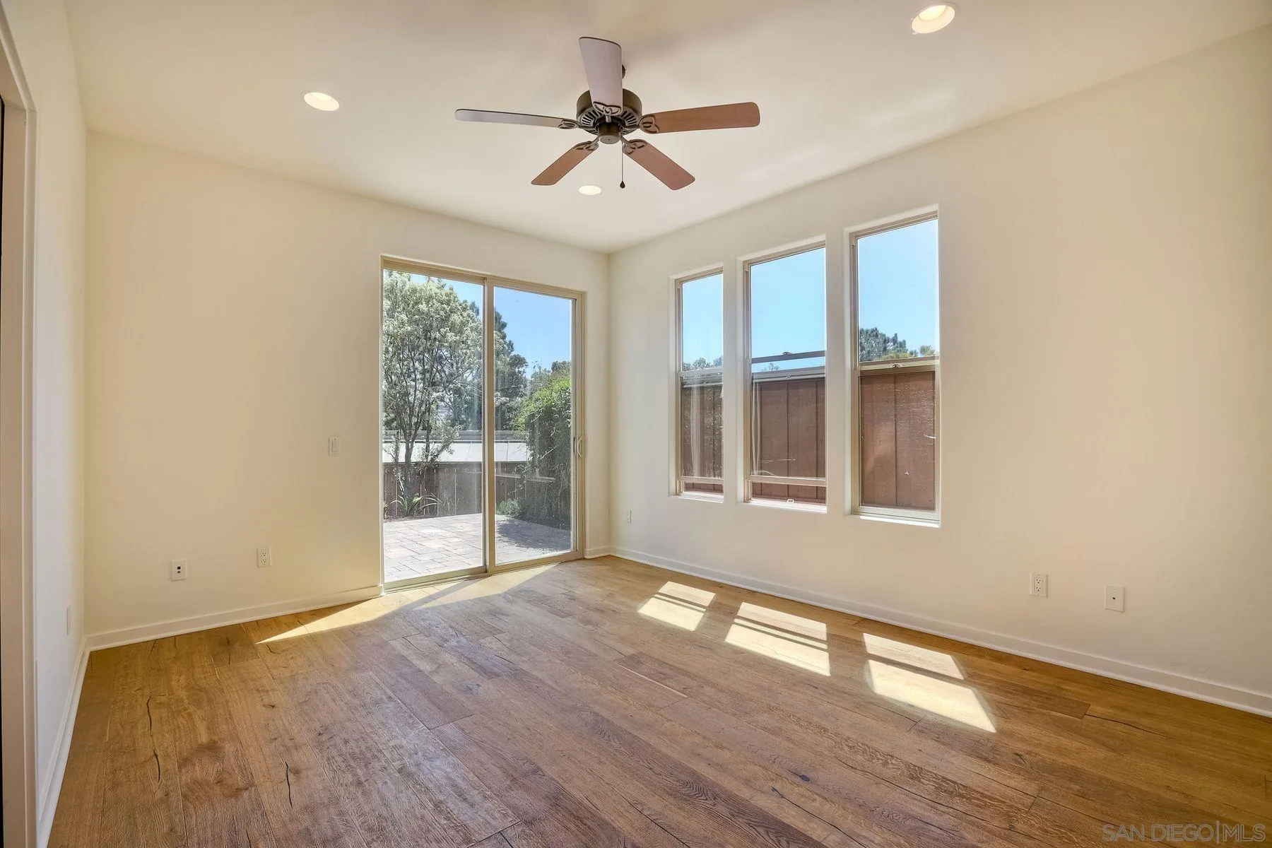 2009 MacKinnon Avenue Encinitas, CA 92007 - Photo 18 of 46 a view of an empty room with wooden floor and a window