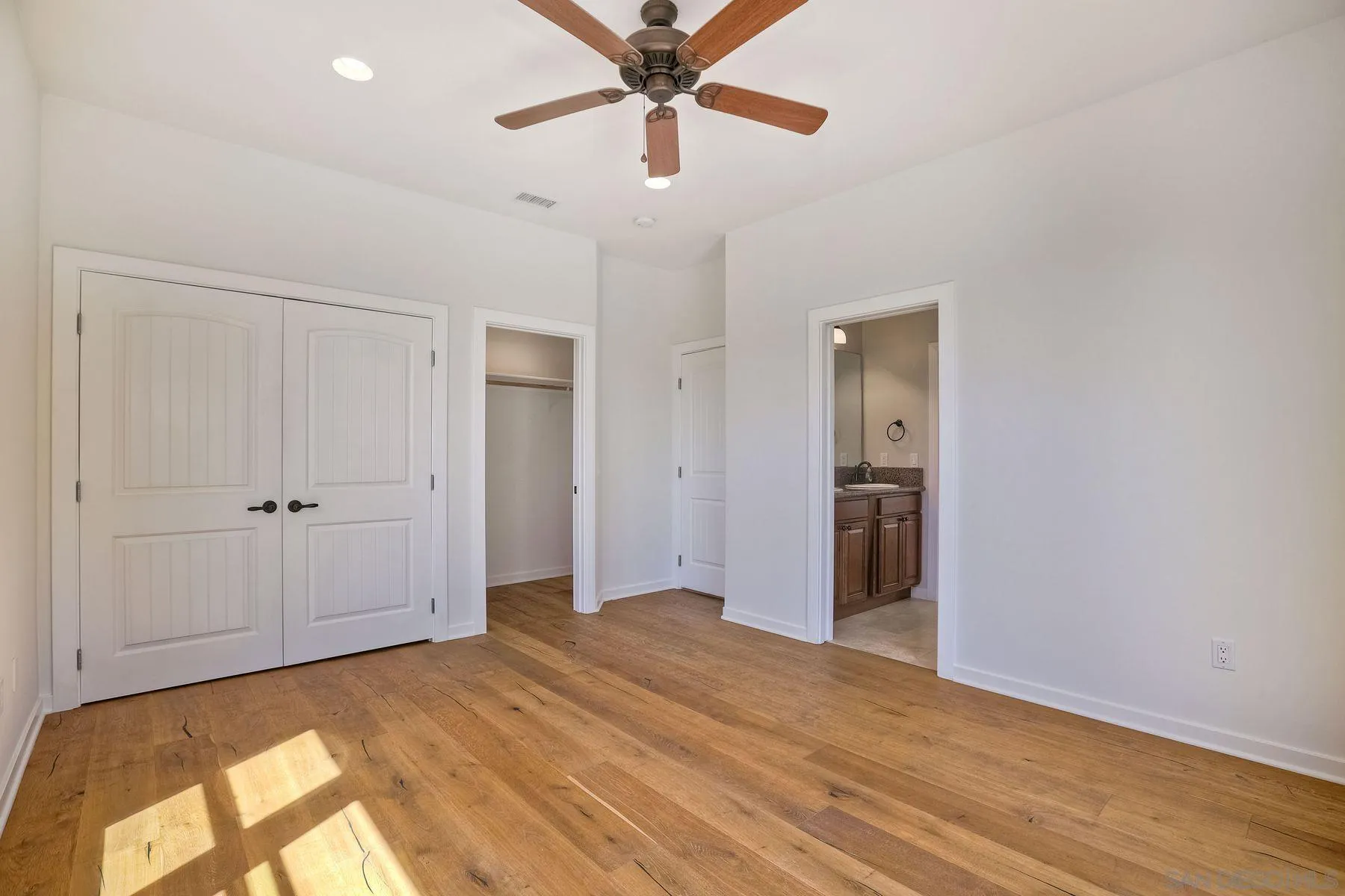 2009 MacKinnon Avenue Encinitas, CA 92007 - Photo 19 of 46 a view of a big room with wooden floor and closet in a room