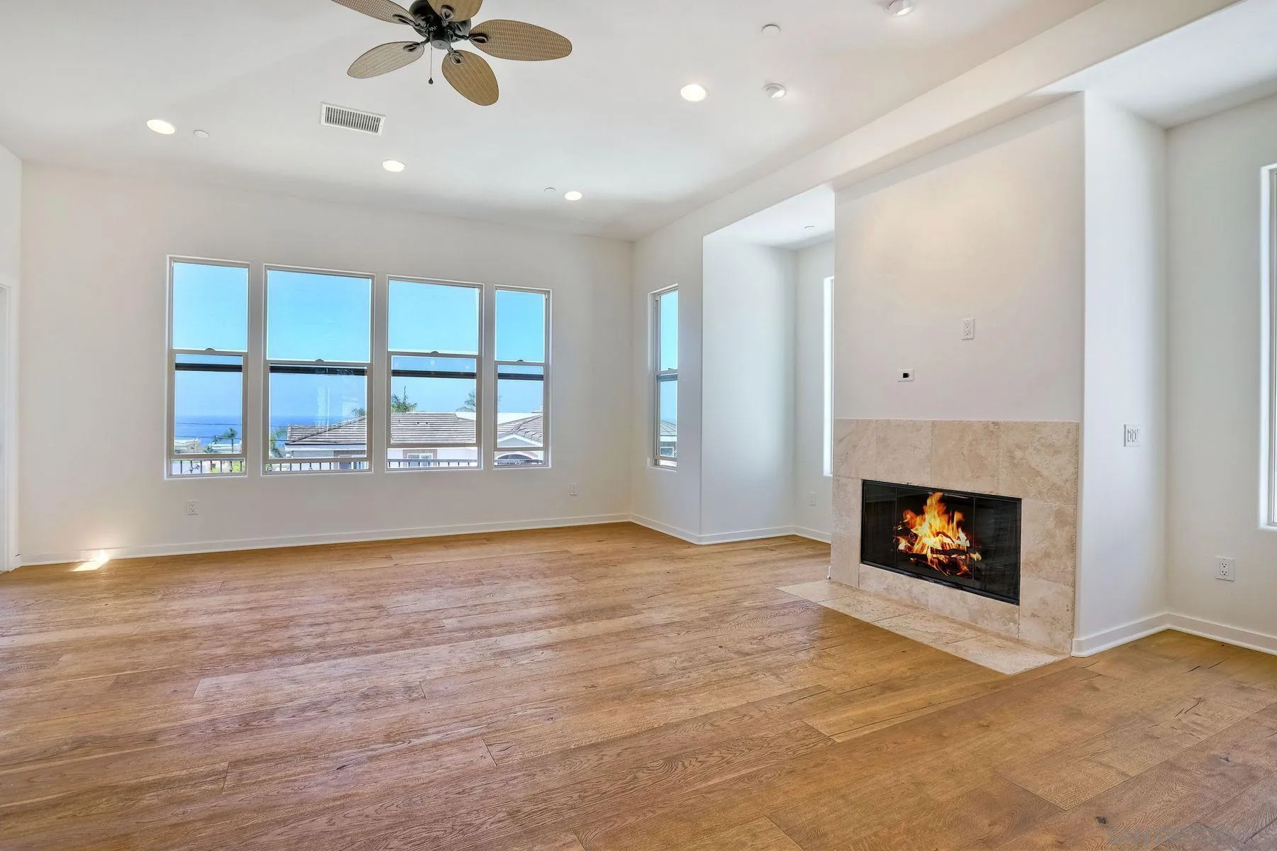 2009 MacKinnon Avenue Encinitas, CA 92007 - Photo 2 of 46 an empty room with windows and fireplace