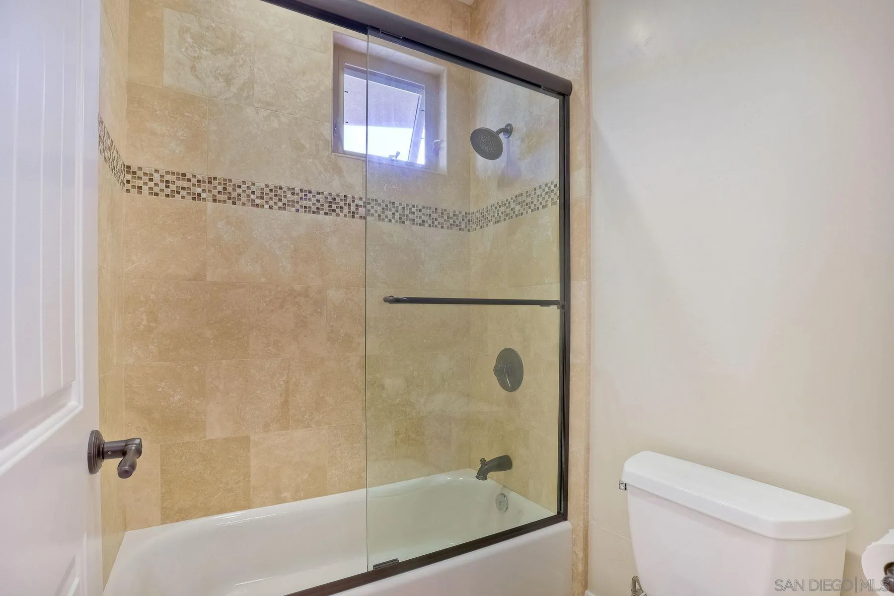 2009 MacKinnon Avenue Encinitas, CA 92007 - Photo 23 of 46 a bathroom with a shower and toilet