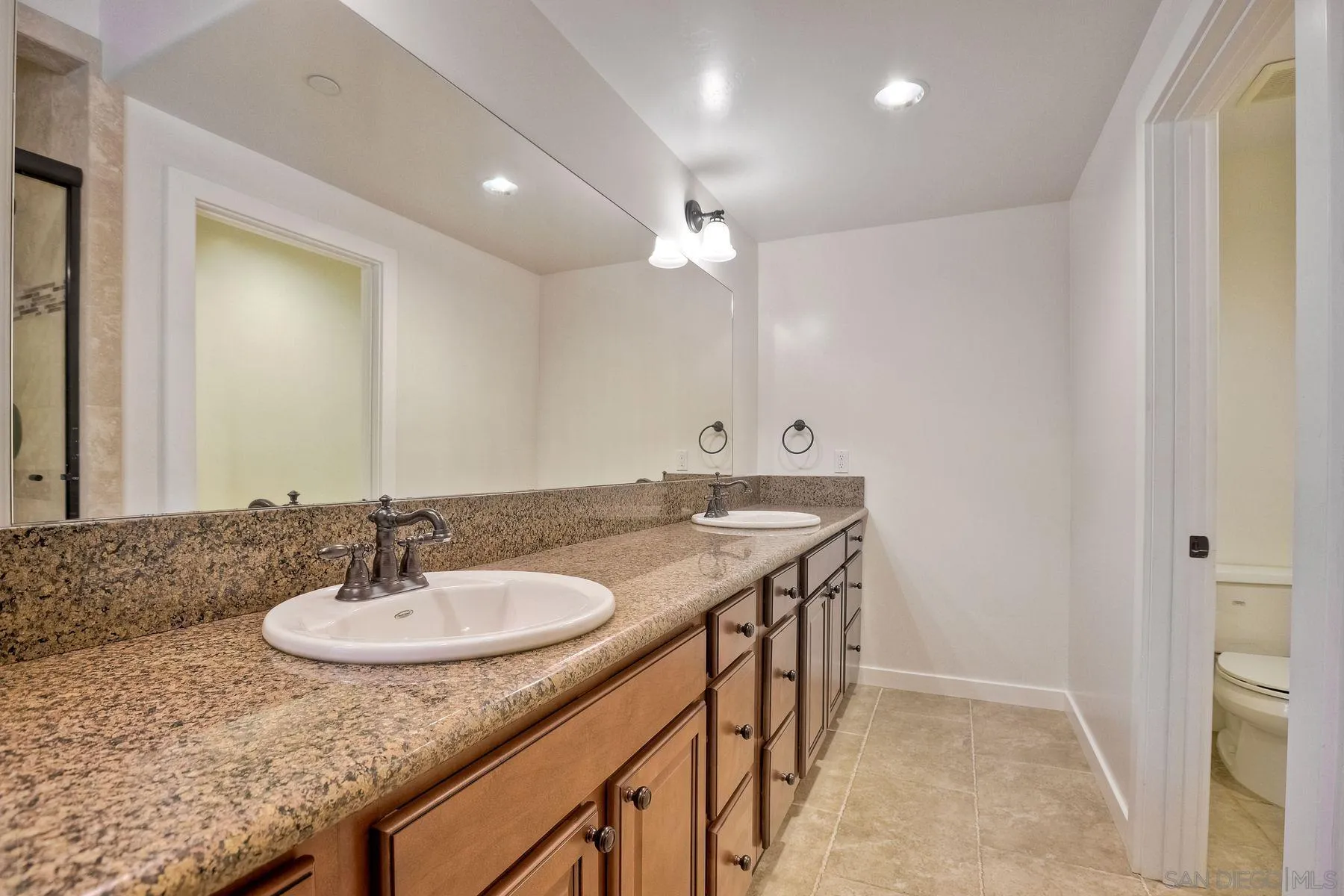 2009 MacKinnon Avenue Encinitas, CA 92007 - Photo 31 of 46 a bathroom with a sink double vanity and a mirror