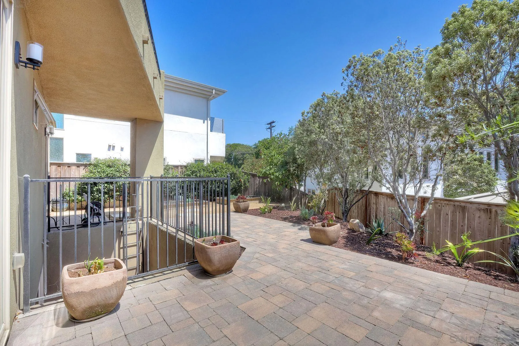 2009 MacKinnon Avenue Encinitas, CA 92007 - Photo 36 of 46 a view of a backyard with a fire pit and furniture