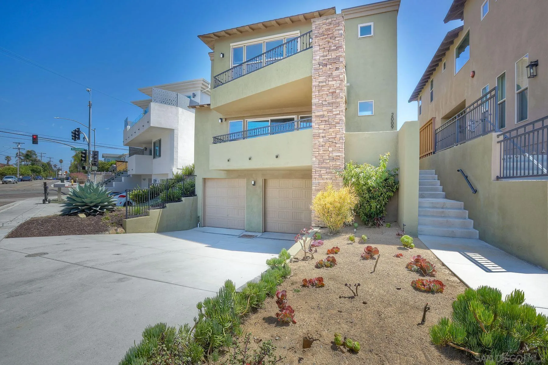 2009 MacKinnon Avenue Encinitas, CA 92007 - Photo 40 of 46 a front view of a house with a yard
