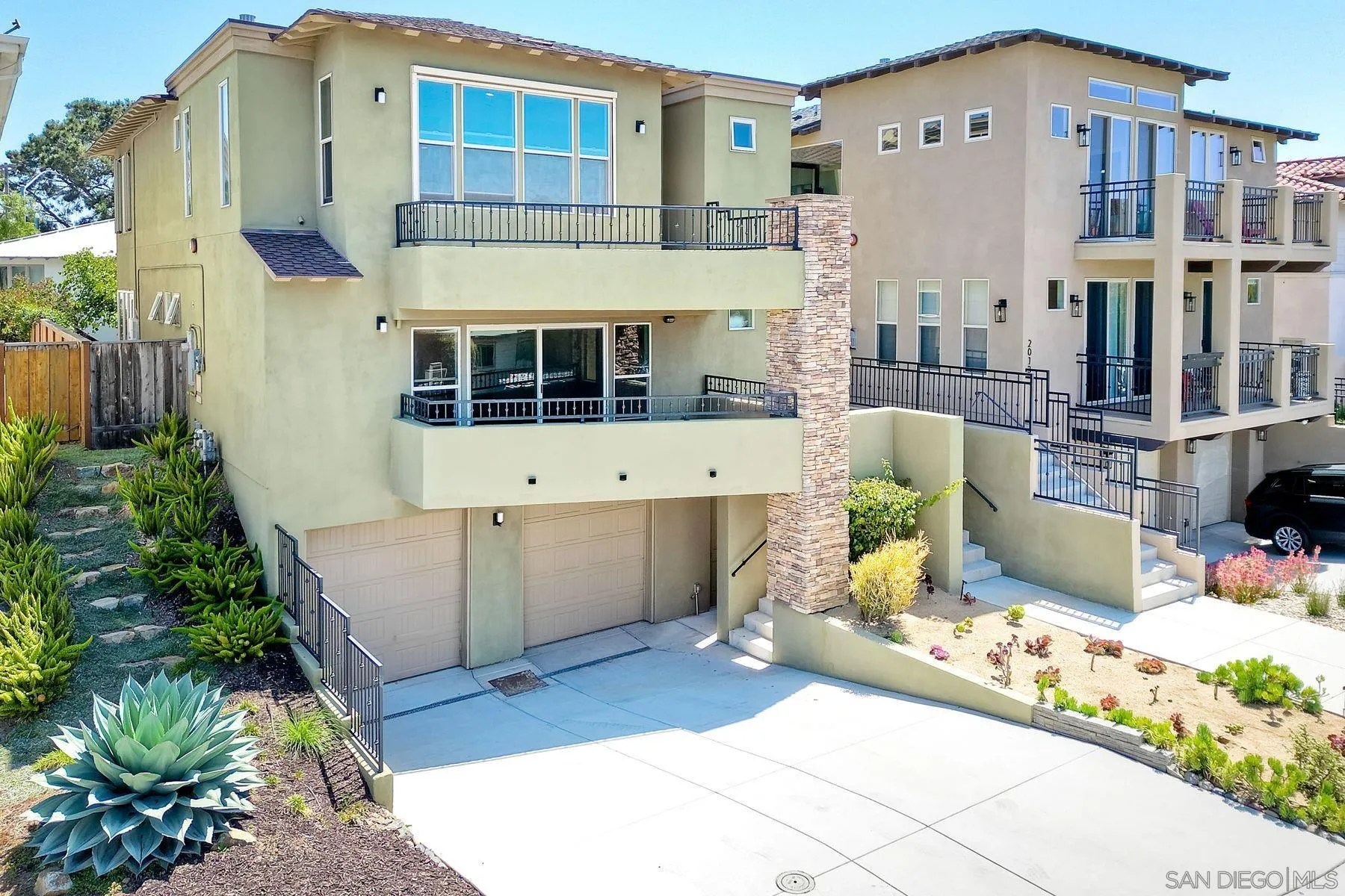 2009 MacKinnon Avenue Encinitas, CA 92007 - Photo 8 of 46 a front view of a building with a garden