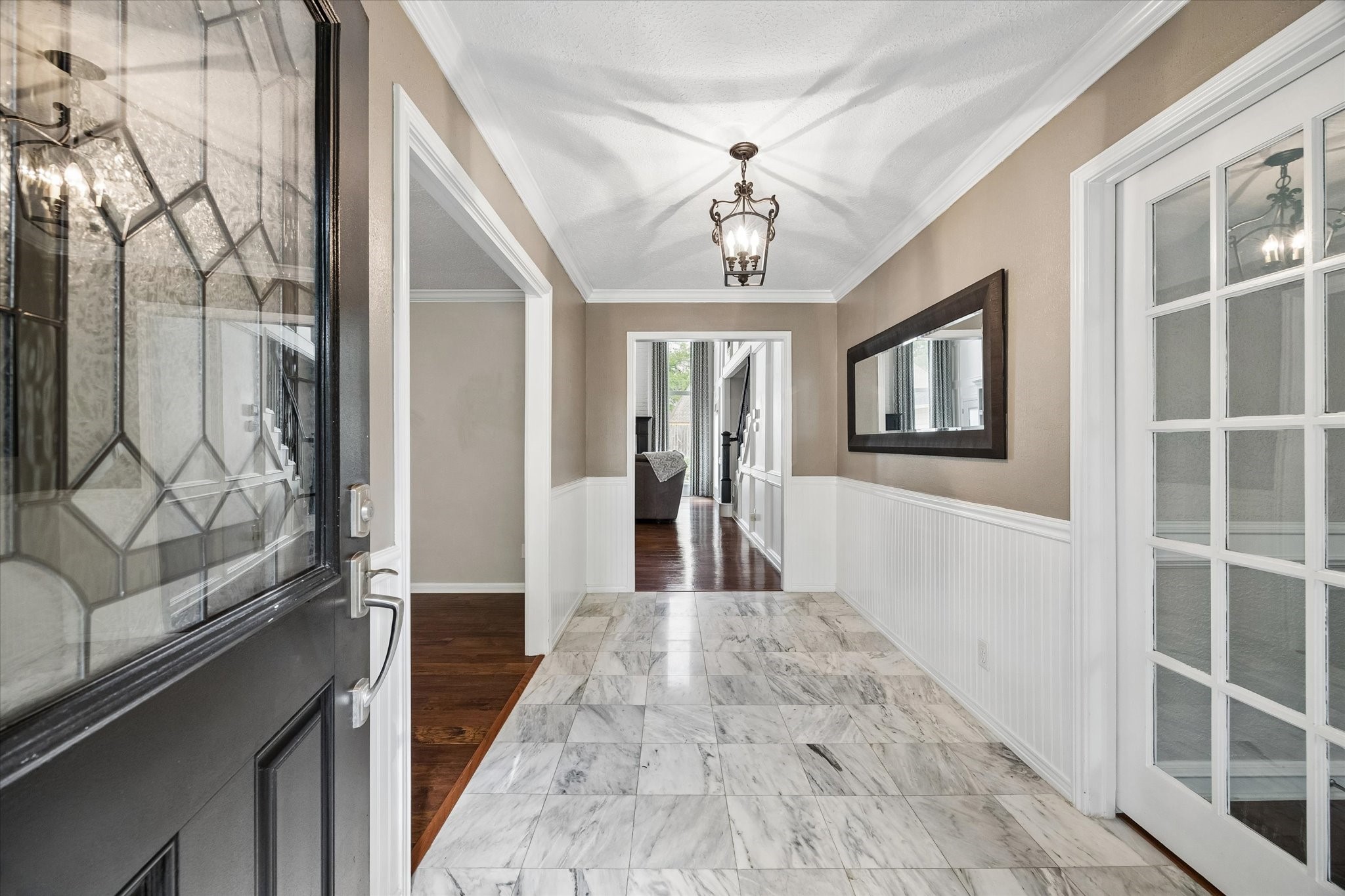 9410 Taidswood Drive Spring, TX 77379 - Photo 11 of 40 This front entry features easy access to the home office on the right and the formal living room/sitting area to the left, and the family room/great room straight ahead.