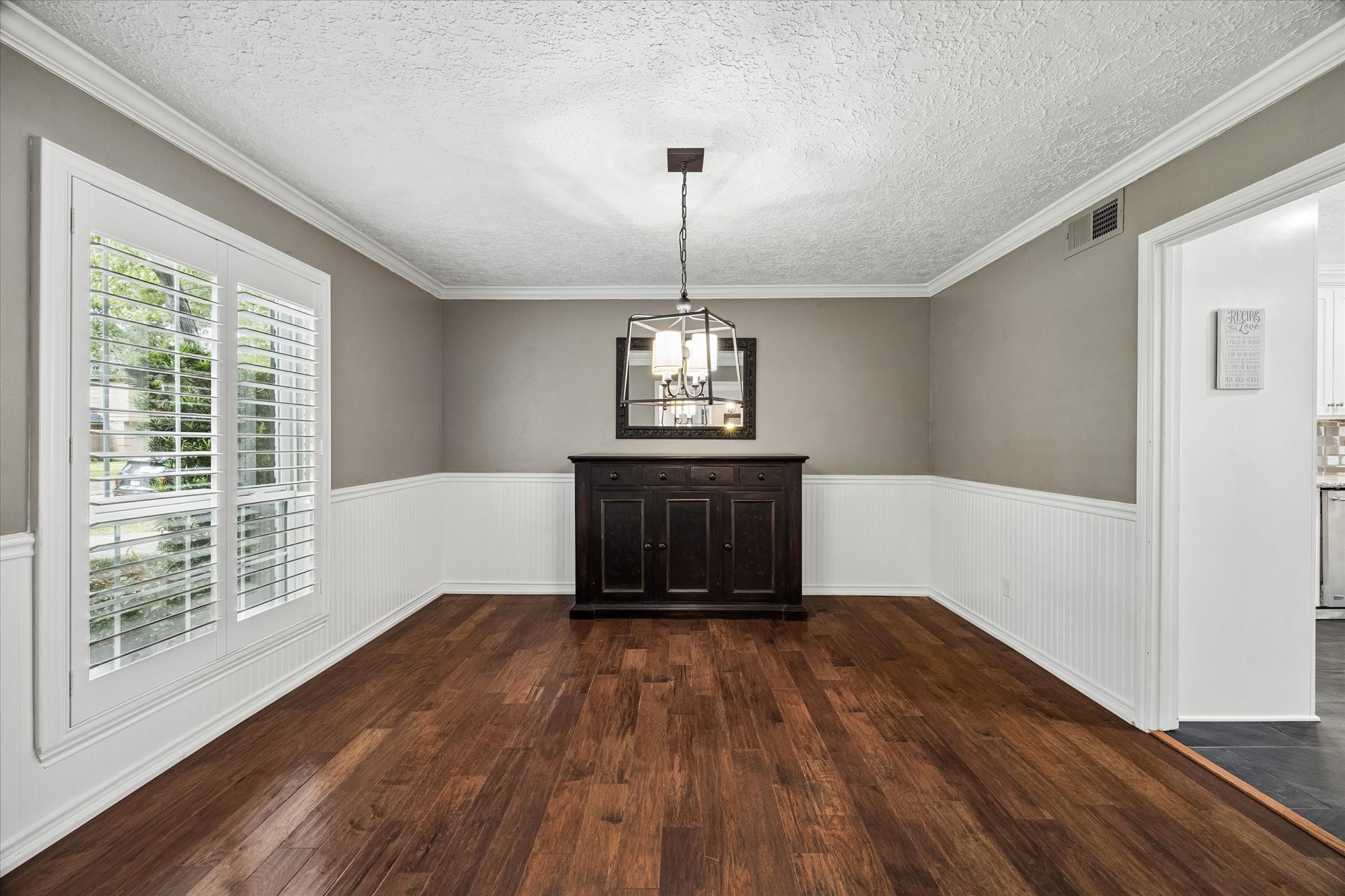 9410 Taidswood Drive Spring, TX 77379 - Photo 14 of 40 The formal dining room is just beyond the formal living room and opens into the kitchen, features a window facing the beautiful front yard and street, and fits a large dining table, and even a pool table.