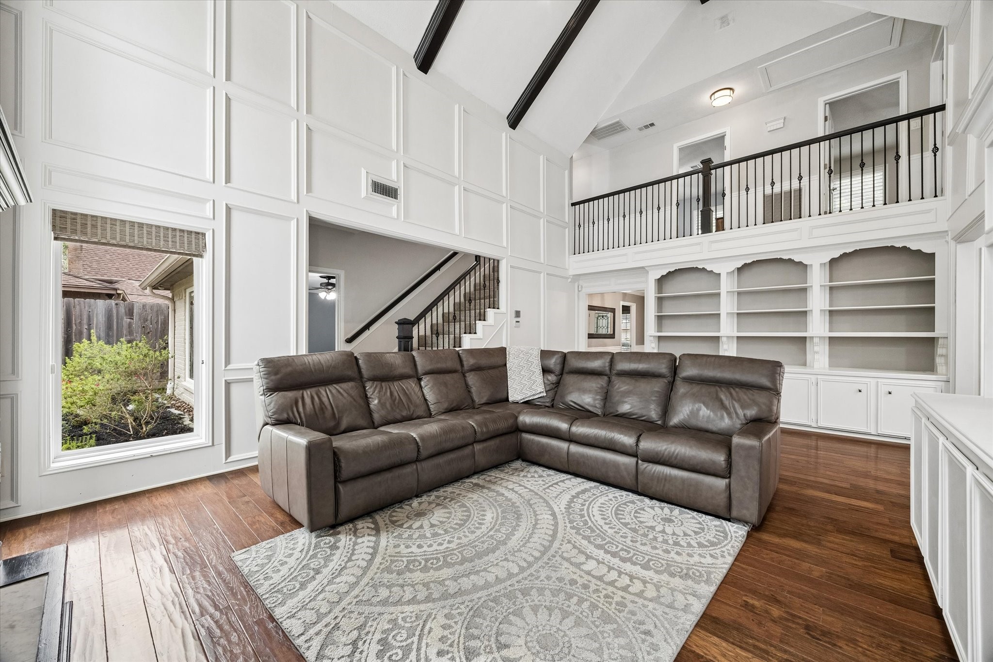 9410 Taidswood Drive Spring, TX 77379 - Photo 18 of 40 From this angle you can see the stairs and updated banister and entrance into the primary bedroom suite.