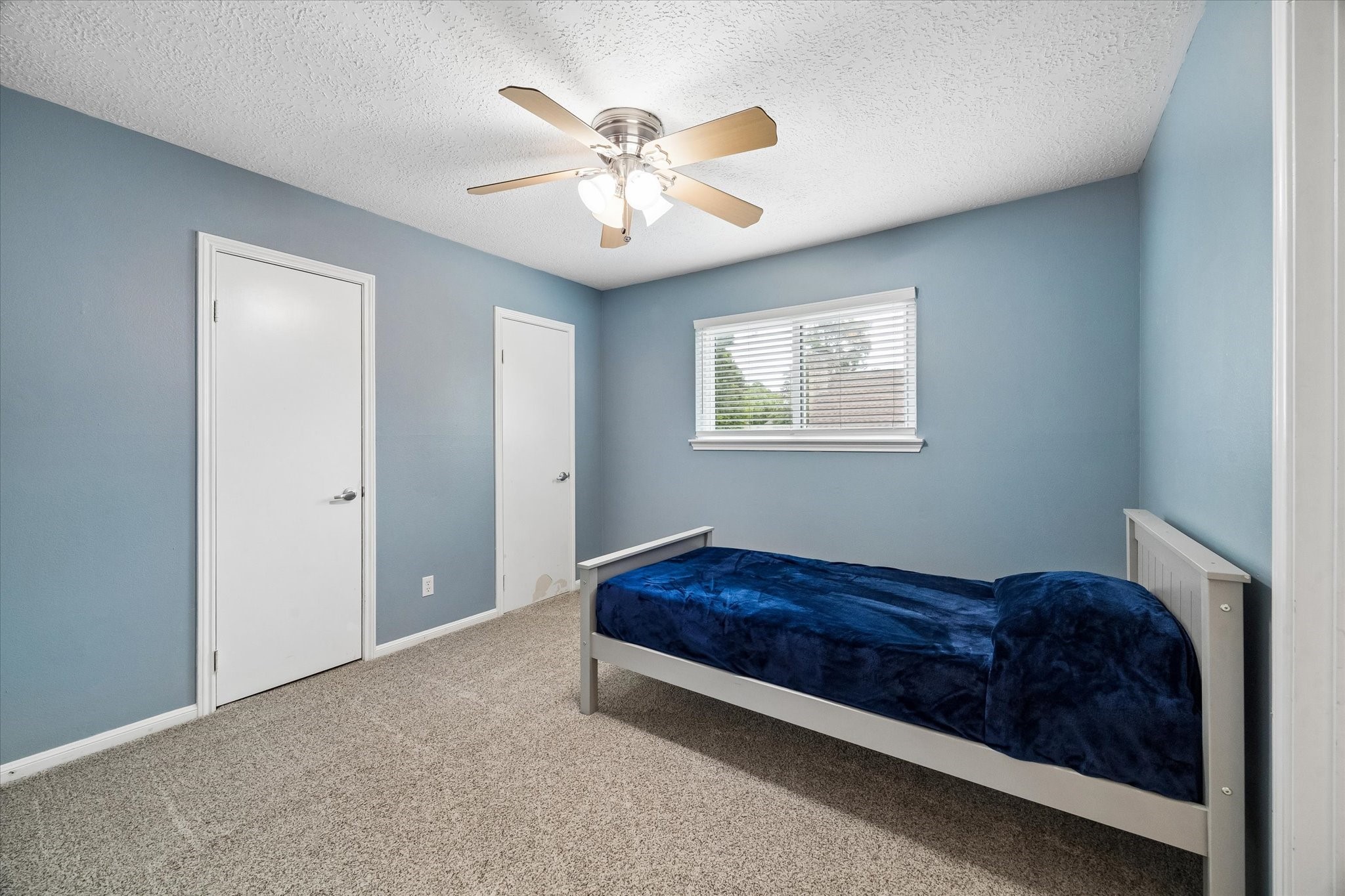 9410 Taidswood Drive Spring, TX 77379 - Photo 31 of 40 The first secondary bedroom at the top of the stairs has access to a shared jack and jill style bathroom and closet space and includes a ceiling fan, a must have in the Houston area.