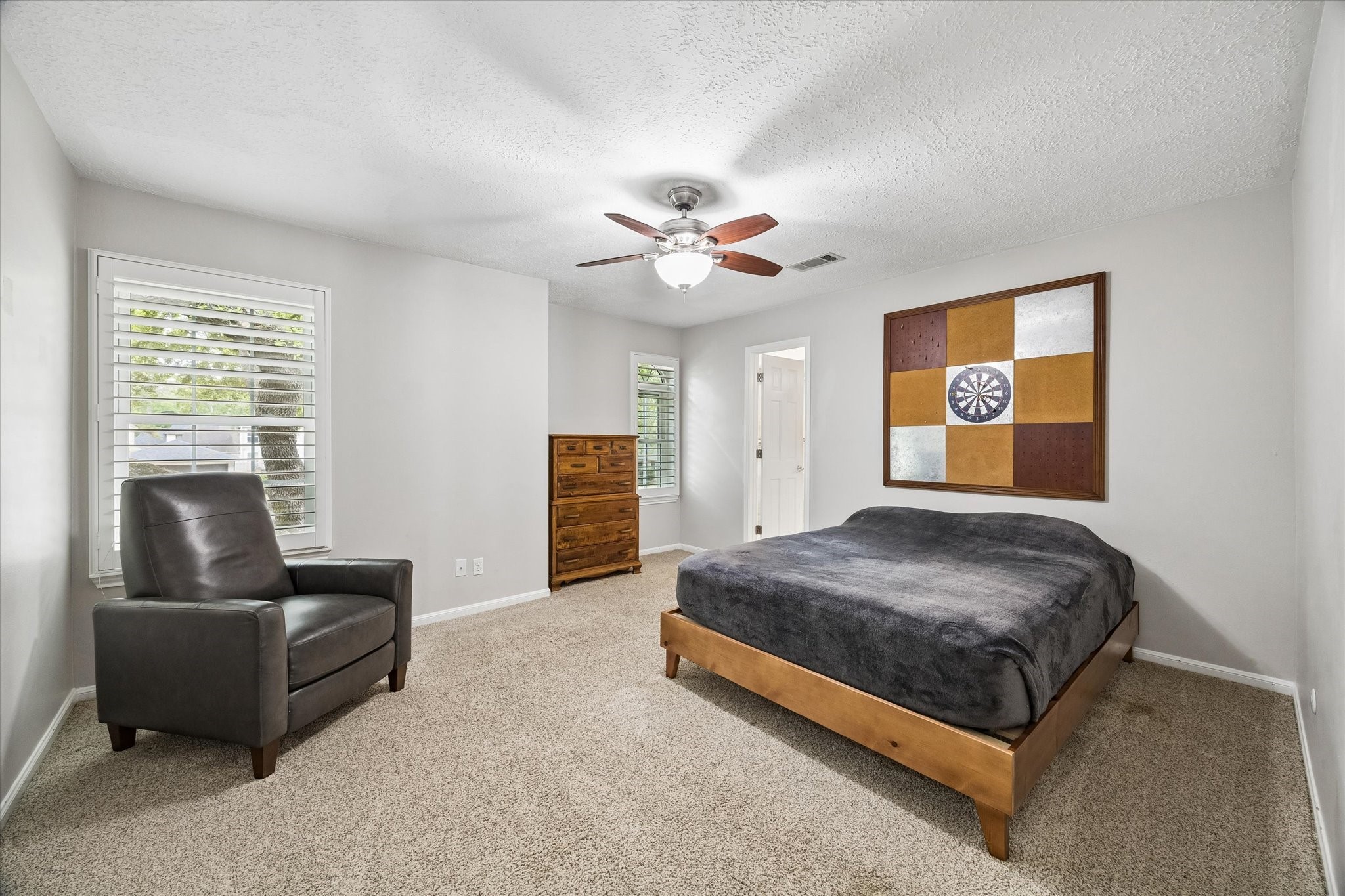 9410 Taidswood Drive Spring, TX 77379 - Photo 34 of 40 The third upstairs secondary bedroom has it's own semi private ensuite, meaning only this bedroom is attached to the third ensuite, but there is an access door to the upstairs game room. Guests can utilize this ensuite bathroom by accessing the bathroom from the additional door.