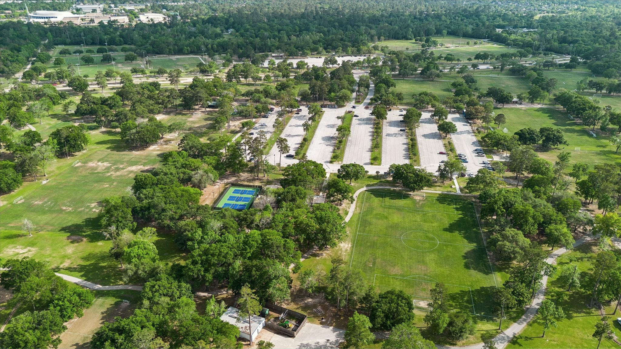 9410 Taidswood Drive Spring, TX 77379 - Photo 38 of 40 This is a view of the nearby park amenities to Champion Forest and if you love Pickleball, you can see quite a few courts here for residents to enjoy! Soccer fields and so much more for you to explore here at your new home in Champion Forest!