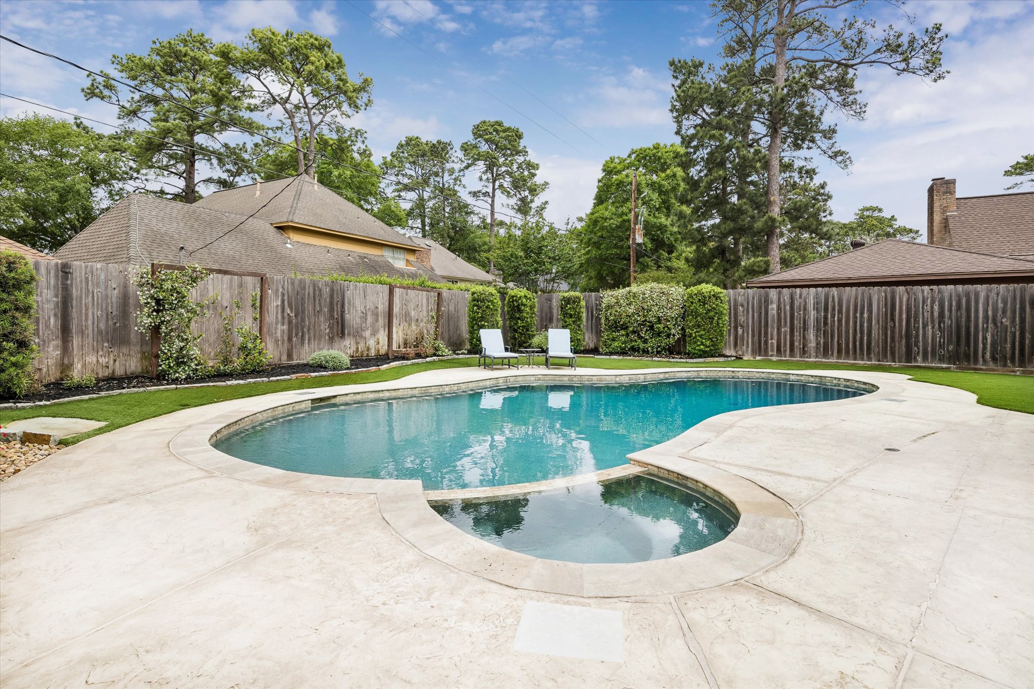 9410 Taidswood Drive Spring, TX 77379 - Photo 5 of 40 This gunnite pool and spa with large wrap-around patio and fully turfed backyard will make your summer time dreams come true!