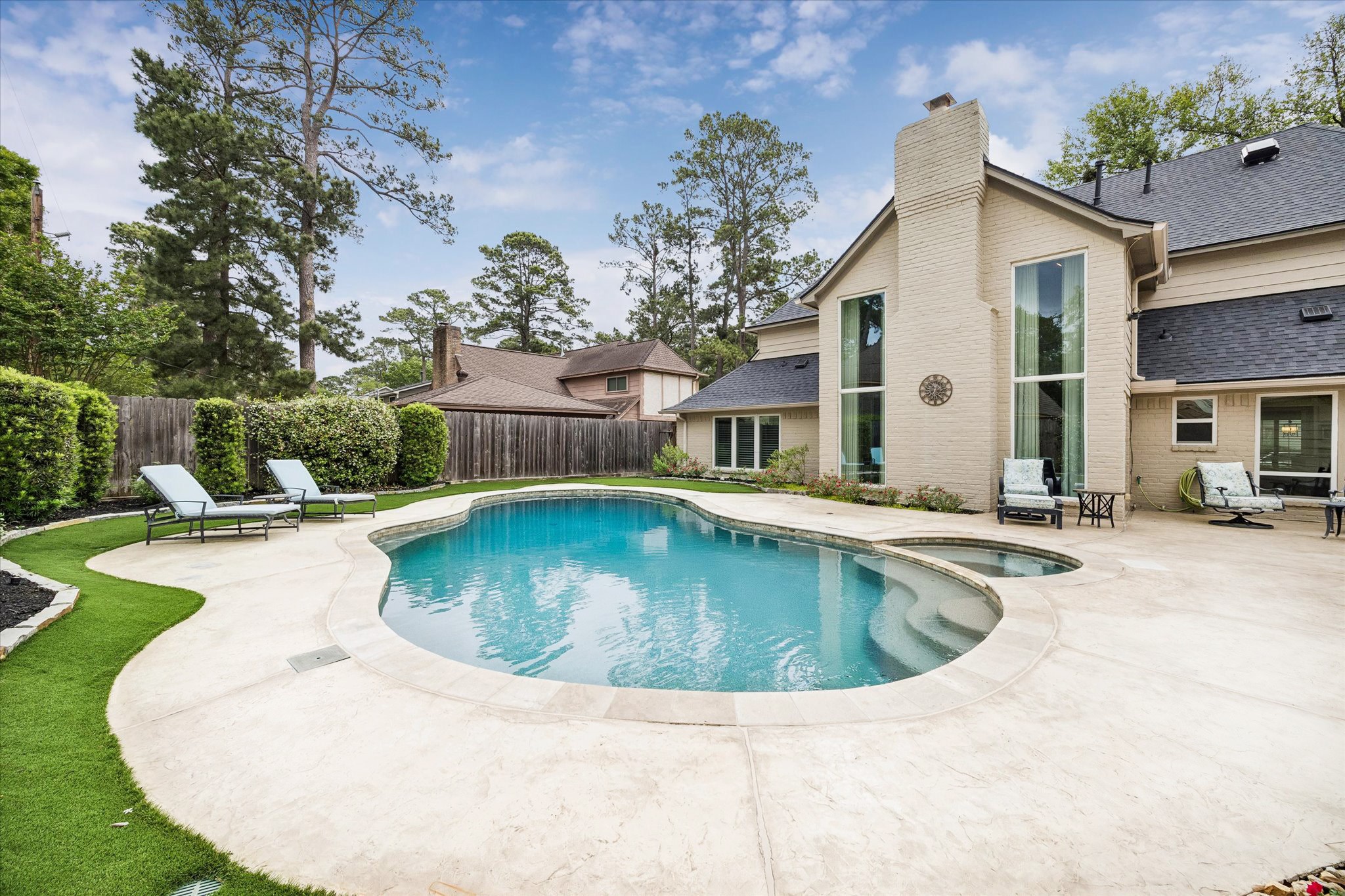 9410 Taidswood Drive Spring, TX 77379 - Photo 6 of 40 There's no lawn to mow back here and absolutely no weeds to pull with this gorgeous synthetic turf yard, professionally installed. Look how much amazing space you have to entertain and play in this backyard retreat?