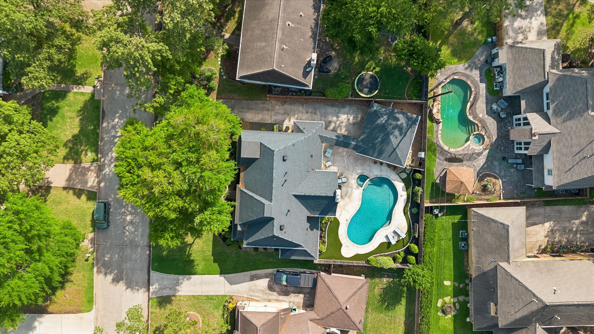 9410 Taidswood Drive Spring, TX 77379 - Photo 9 of 40 Check out this beautiful roof recently installed. This yard is stunning from all angles, even above!