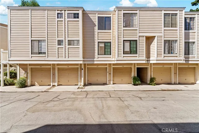 a front view of a building with a road
