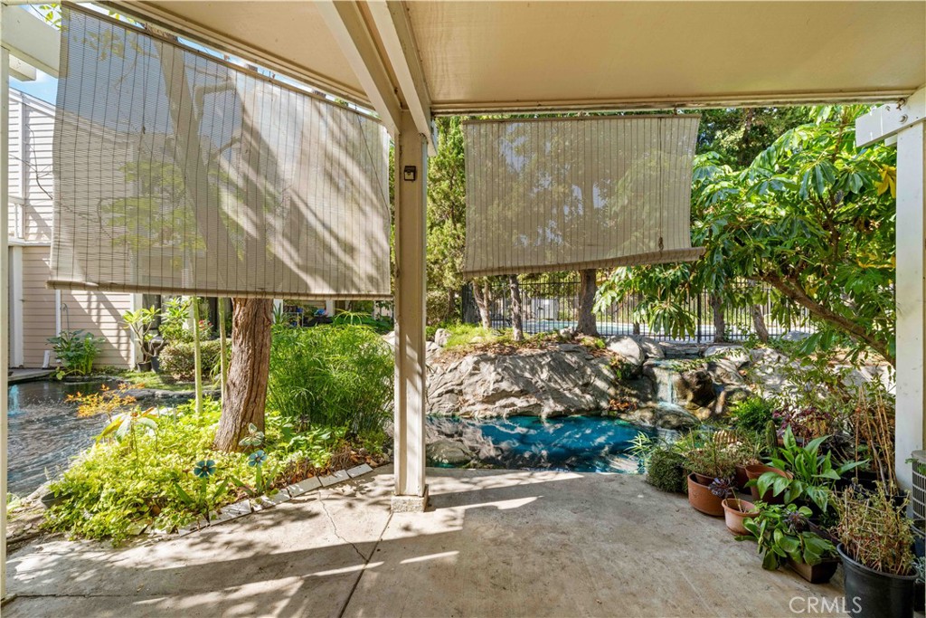4900 North Grand Avenue, Unit 131 Covina, CA 91724 - Photo 2 of 12 a view of a street with potted plants
