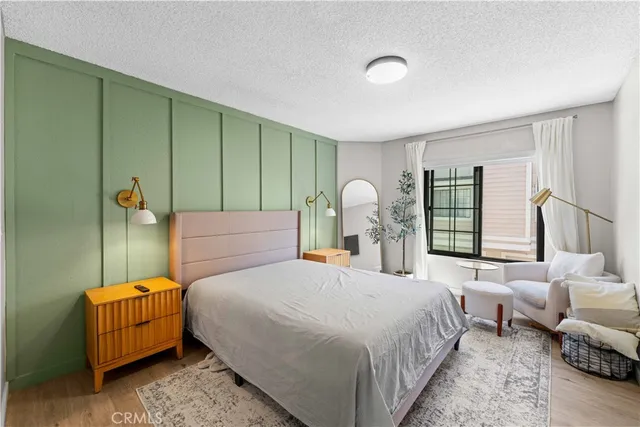 a bedroom with a bed and window