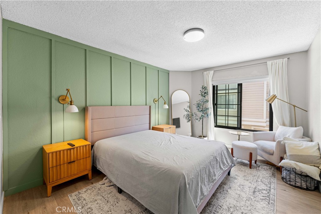 4900 North Grand Avenue, Unit 131 Covina, CA 91724 - Photo 4 of 12 a bedroom with a bed and window