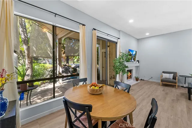 a view of a dining room with furniture window and wooden floor