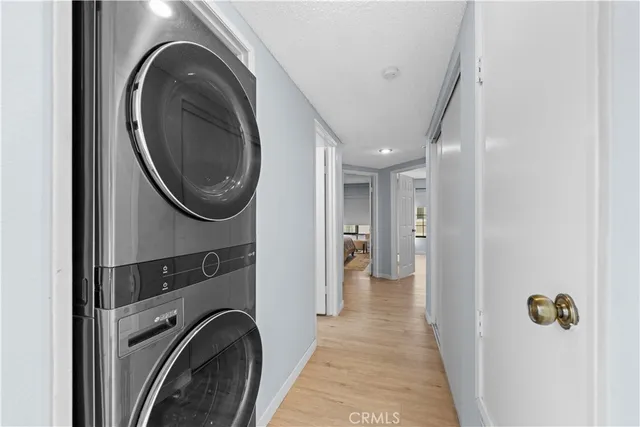 a view of a hallway with washer and dryer