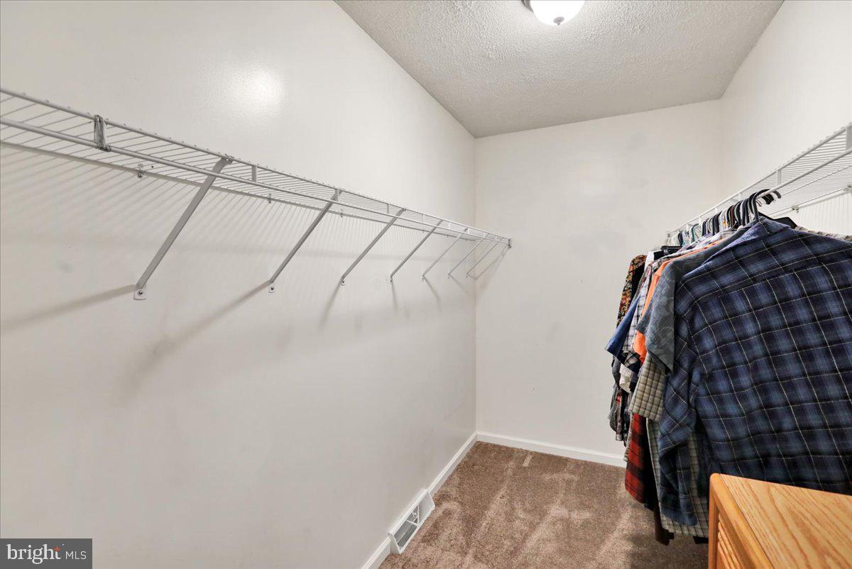 518 Spring Valley Road Reading, PA 19604 - Photo 22 of 49 a view of walk in closet with clothes and shoes