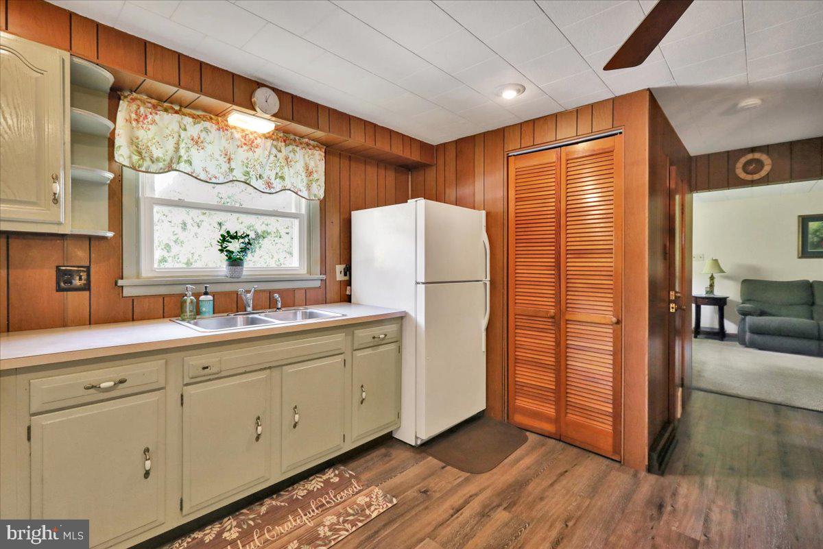518 Spring Valley Road Reading, PA 19604 - Photo 7 of 49 a kitchen with cabinets and wooden floor