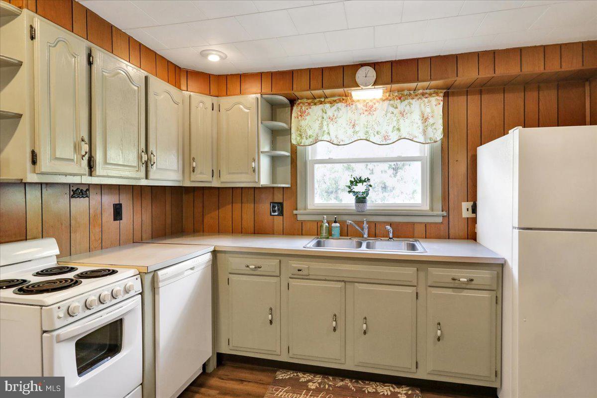 518 Spring Valley Road Reading, PA 19604 - Photo 9 of 49 a kitchen with a white cabinets and white appliances