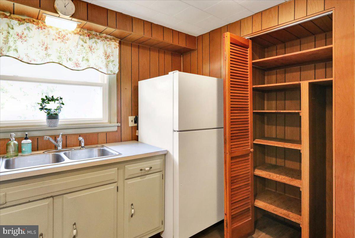 518 Spring Valley Road Reading, PA 19604 - Photo 10 of 49 a kitchen with a refrigerator and a sink