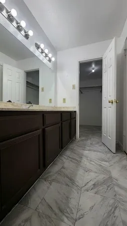 a bathroom with a toilet sink and shower