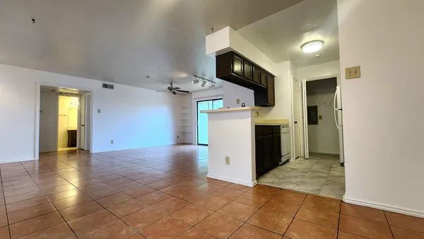 a view of a kitchen with a sink and a fireplace