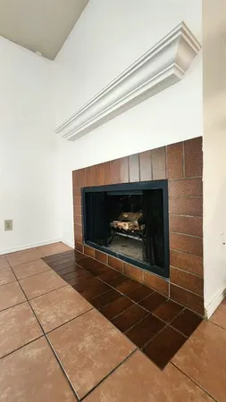 a fireplace with a hallway