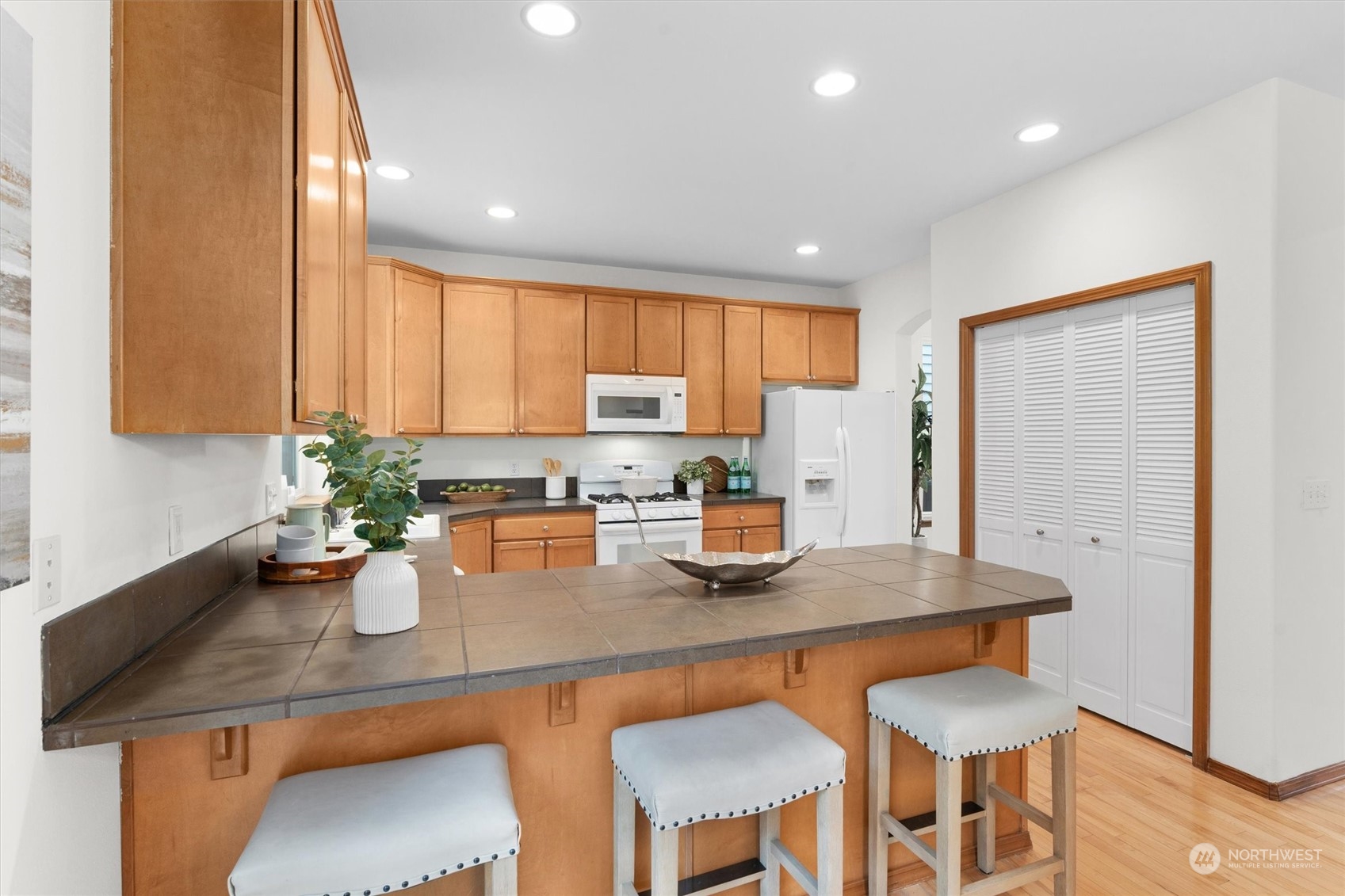 18705 13th Drive Southeast Bothell, WA 98012 - Photo 14 of 40 a kitchen with a table and chairs in it