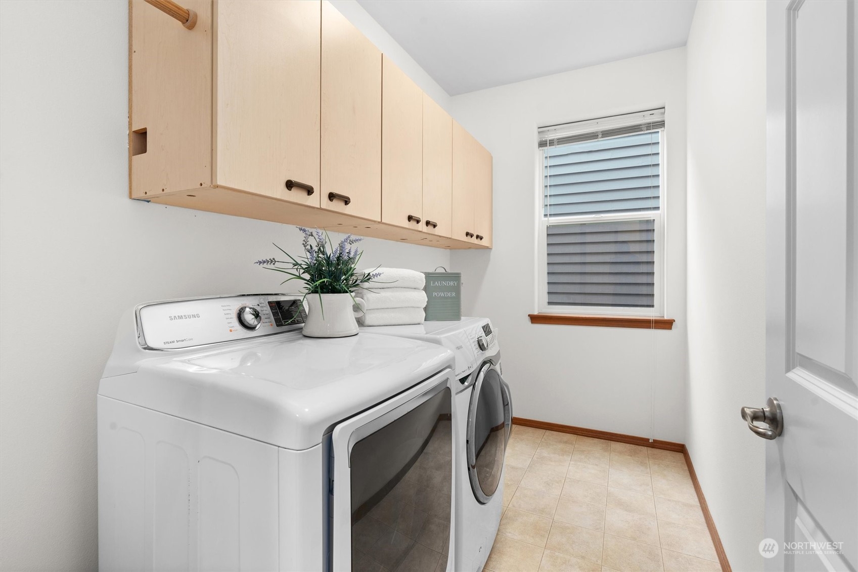 18705 13th Drive Southeast Bothell, WA 98012 - Photo 30 of 40 a kitchen with stainless steel appliances white cabinets and a window