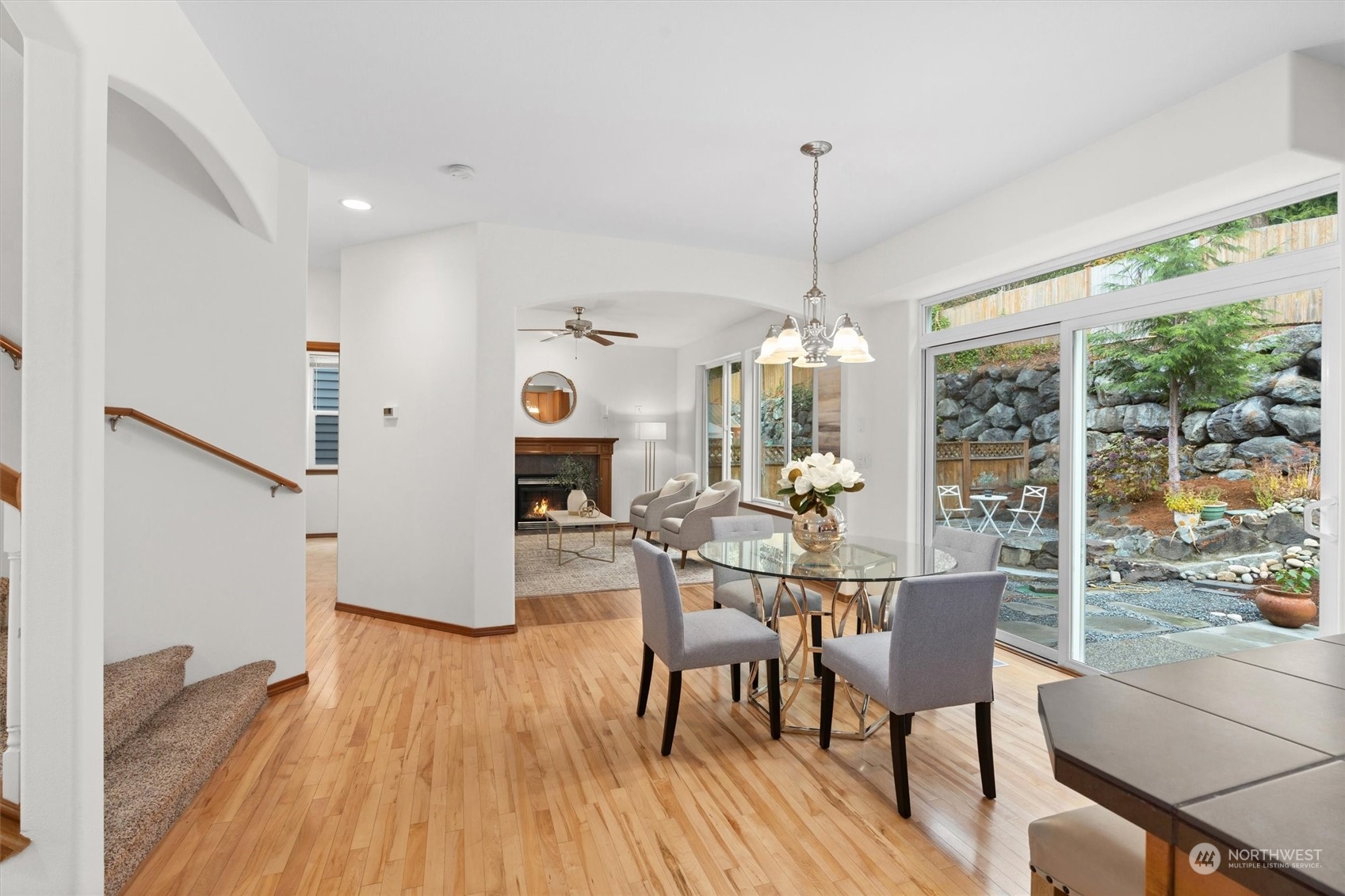 18705 13th Drive Southeast Bothell, WA 98012 - Photo 10 of 40 a dining room with furniture a chandelier and wooden floor