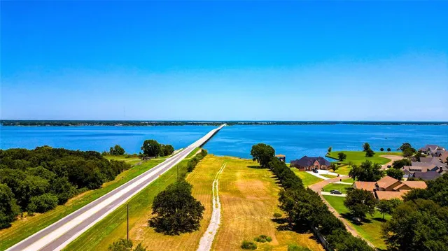 a view of a swimming pool with a table and a chair