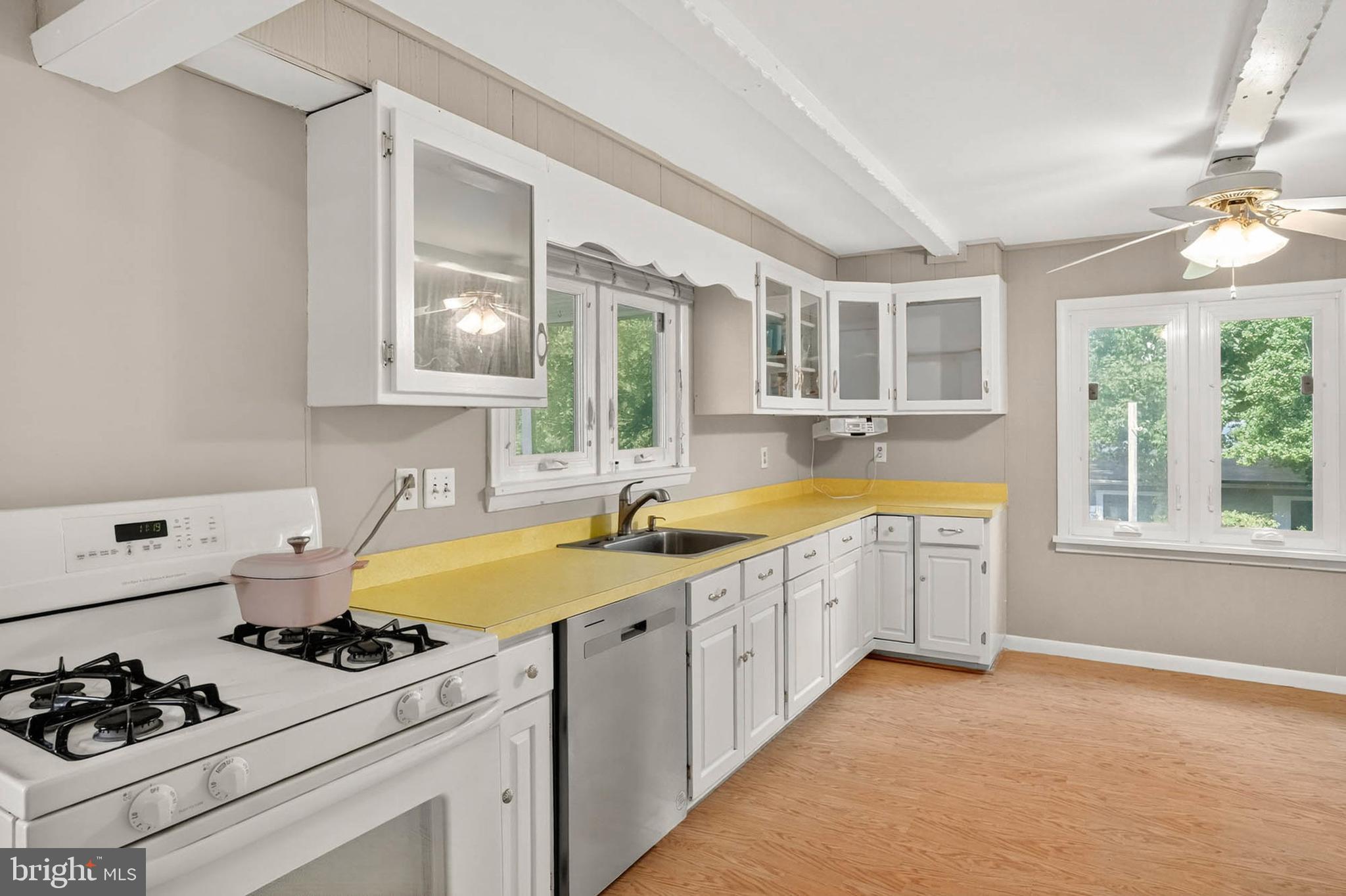 2504 Edgewood Avenue Parkville, MD 21234 - Photo 11 of 25 a kitchen with a sink stove and window