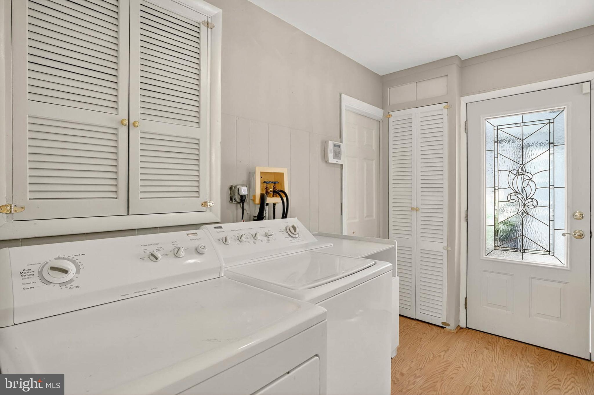 2504 Edgewood Avenue Parkville, MD 21234 - Photo 12 of 25 a view of washer and dryer with bathroom in the background
