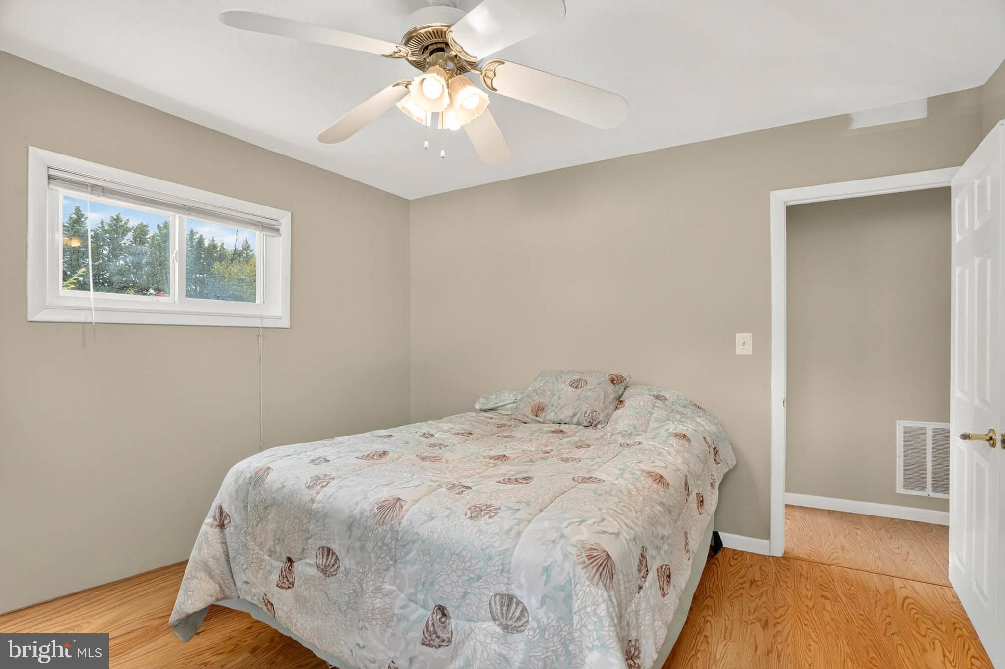 2504 Edgewood Avenue Parkville, MD 21234 - Photo 15 of 25 a bedroom with a bed and a painting on the wall