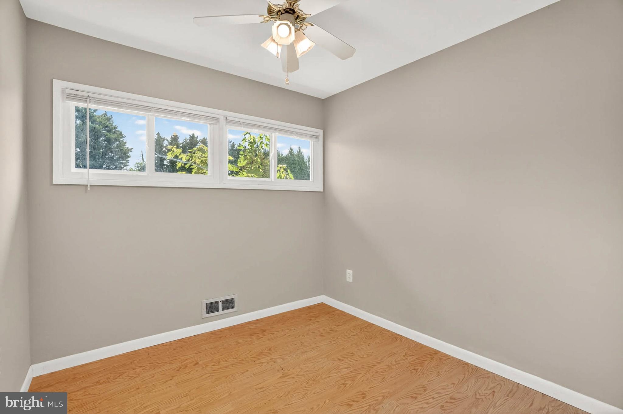 2504 Edgewood Avenue Parkville, MD 21234 - Photo 18 of 25 an empty room with a window