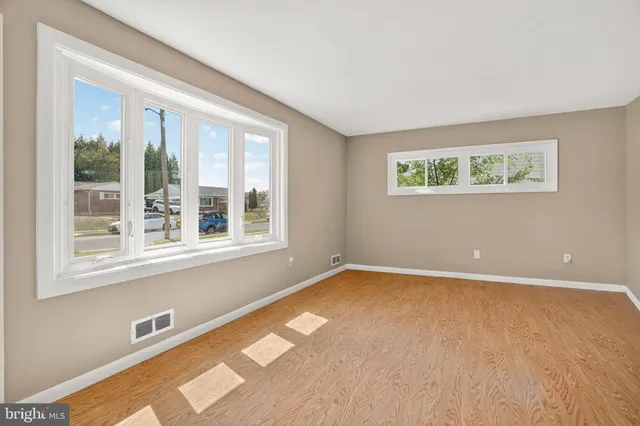 a view of an empty room with a window