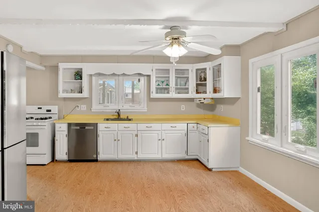 a large kitchen with a large window