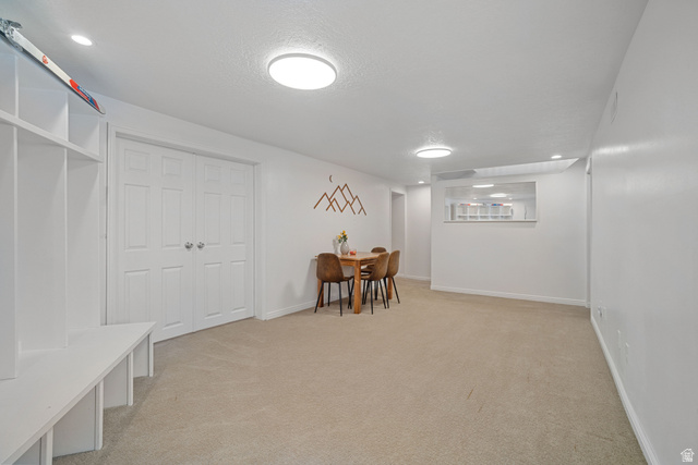 4426 South 3035 East Holladay, UT 84124 - Photo 29 of 49 Finished basement with light colored carpet, recessed lighting, and a textured ceiling