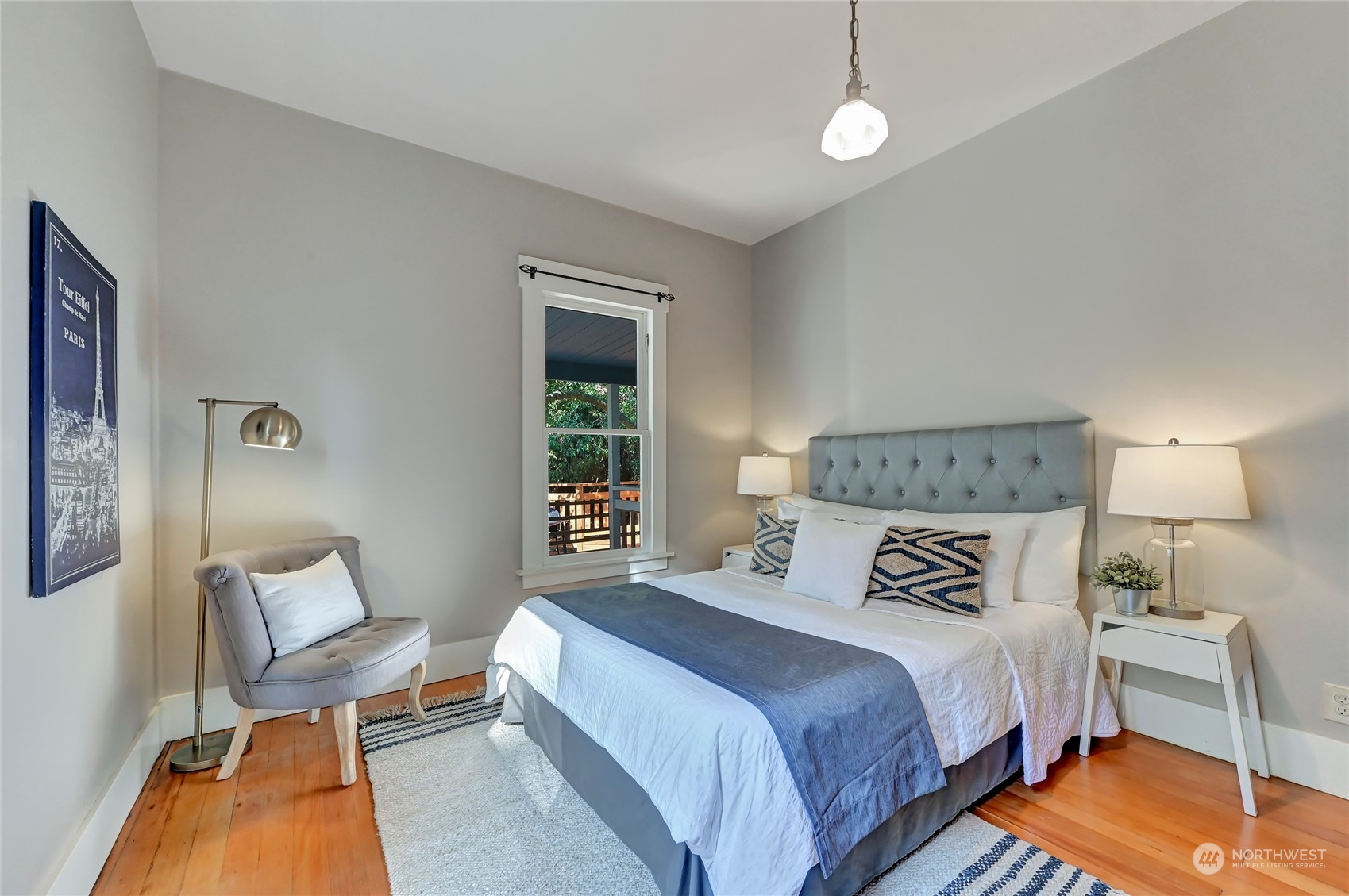 424 North 67th Street Seattle, WA 98103 - Photo 12 of 28 a bedroom with a bed and lamp