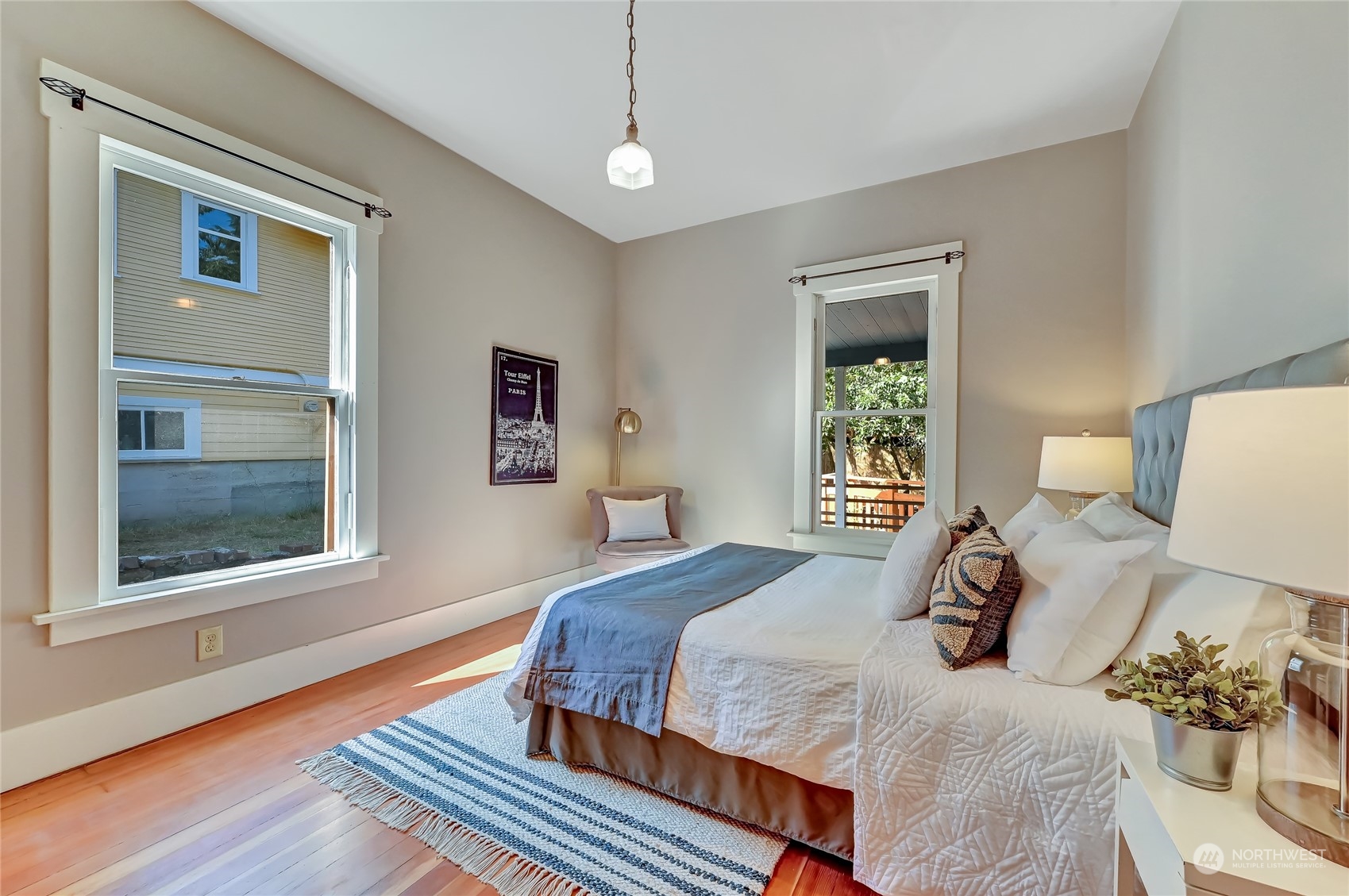 424 North 67th Street Seattle, WA 98103 - Photo 13 of 28 a bedroom with a bed and a window