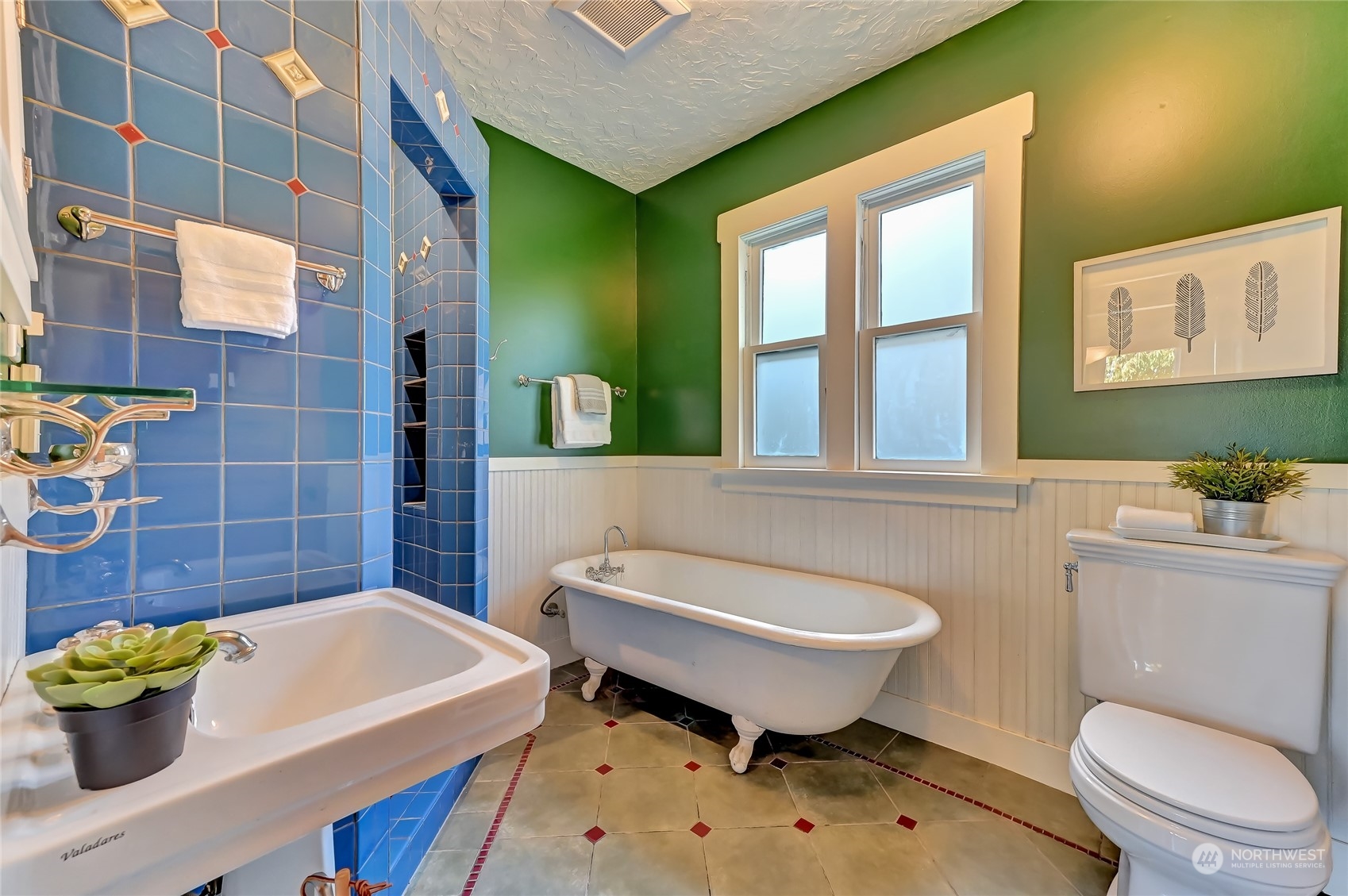 424 North 67th Street Seattle, WA 98103 - Photo 15 of 28 a bathroom with a sink a toilet and a bathtub