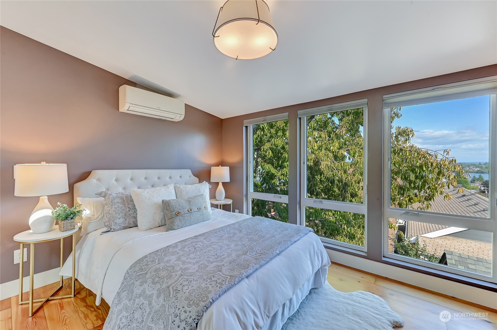 424 North 67th Street Seattle, WA 98103 - Photo 19 of 28 a bedroom with a bed and a large window