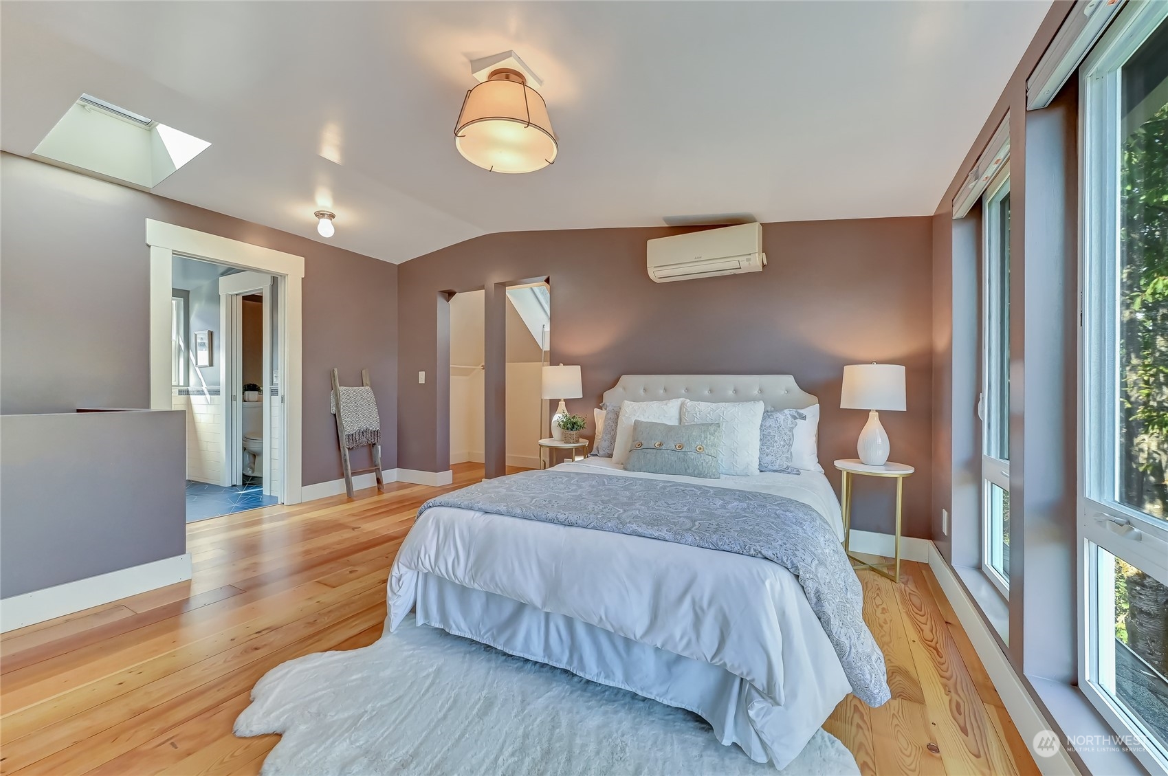 424 North 67th Street Seattle, WA 98103 - Photo 20 of 28 a bedroom with a bed and a large window