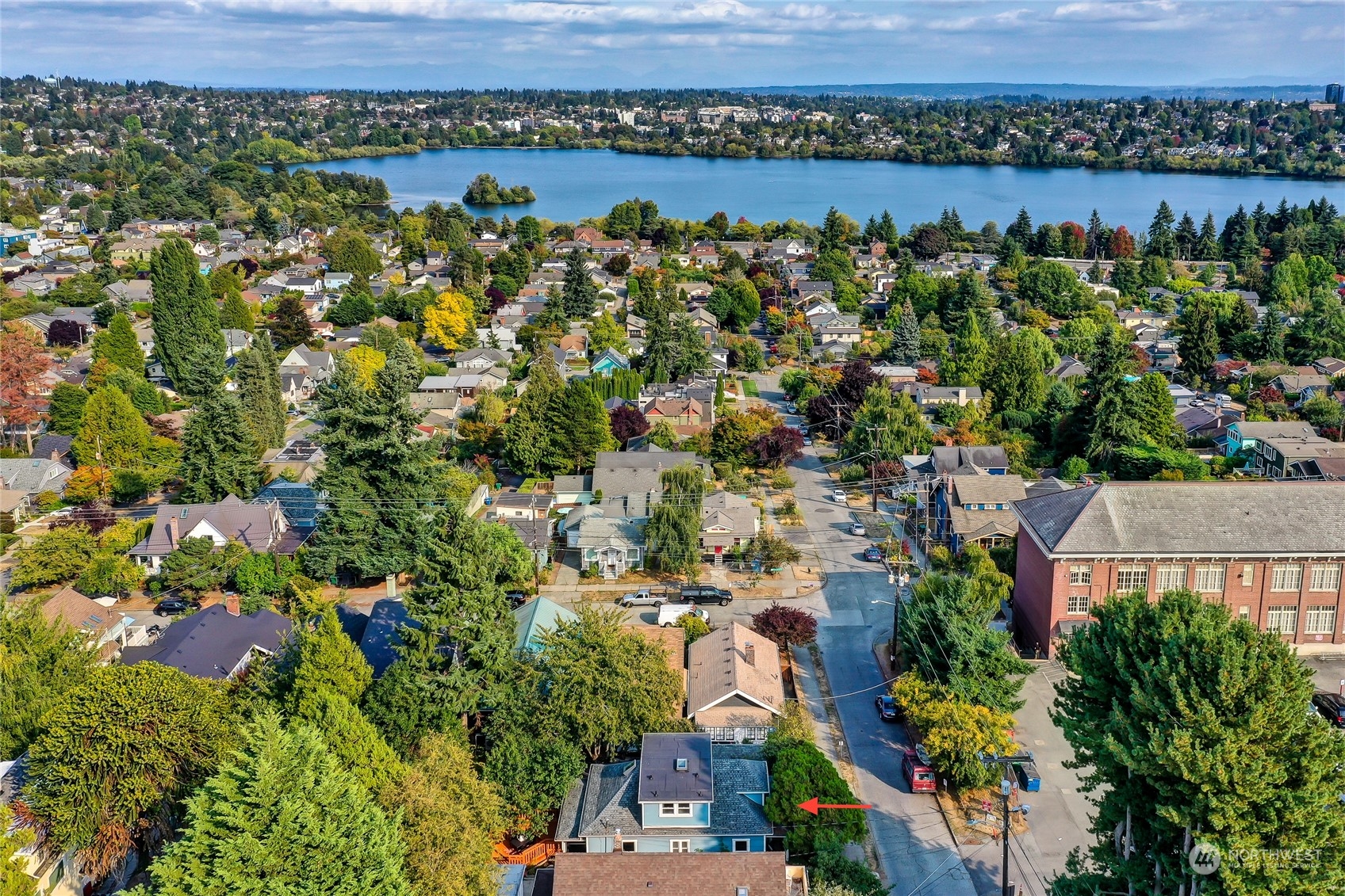 424 North 67th Street Seattle, WA 98103 - Photo 3 of 28 an aerial view of a house with a lake view