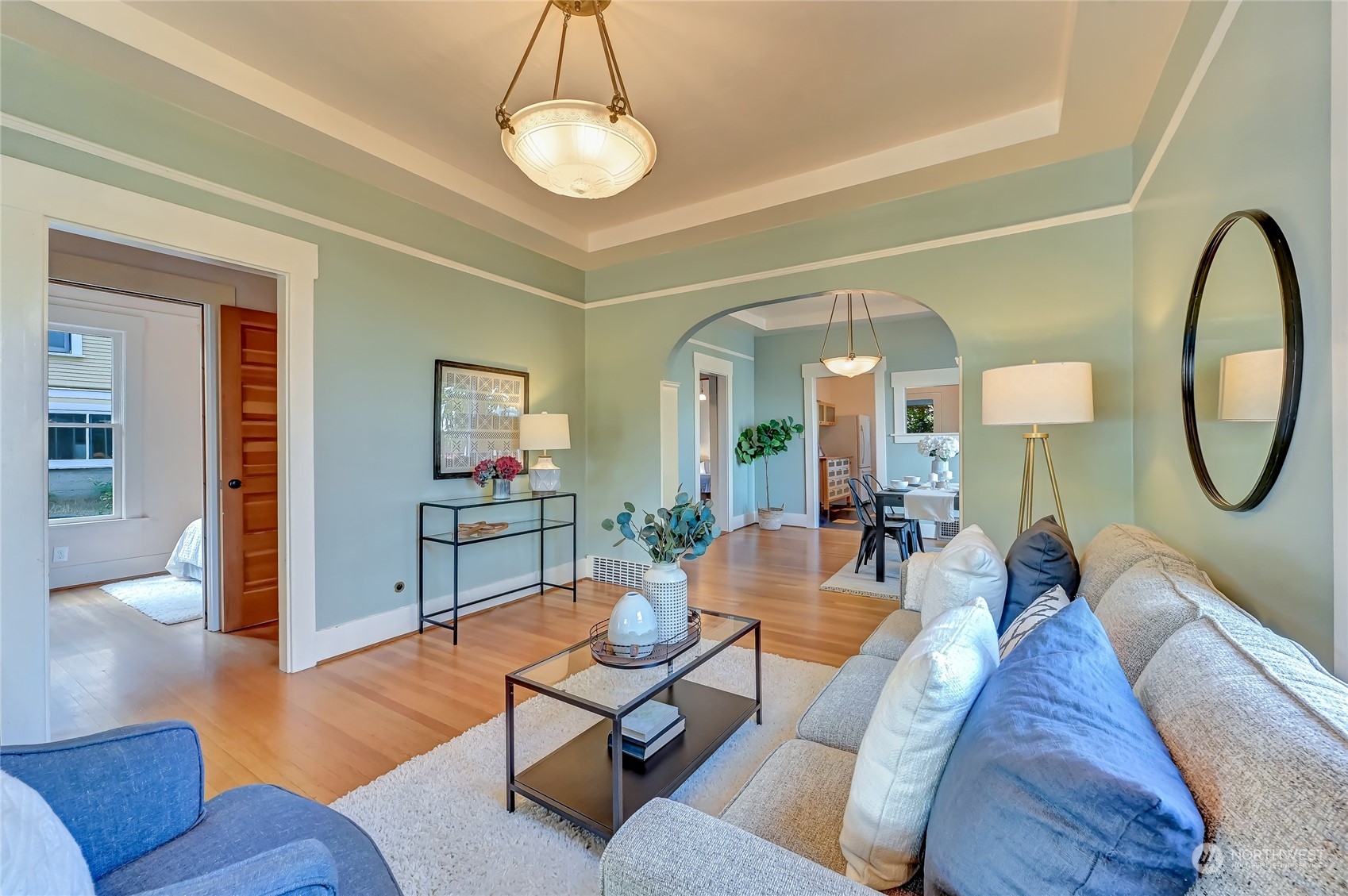 424 North 67th Street Seattle, WA 98103 - Photo 10 of 28 a living room with furniture a rug and a large mirror